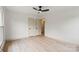 Spacious bedroom with hardwood floors, ceiling fan, and access to an en-suite bathroom at 3937 Tamerlane Dr, Charlotte, NC 28205