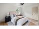 Cozy bedroom with neutral décor, a ceiling fan, and plenty of natural light at 3937 Tamerlane Dr, Charlotte, NC 28205