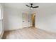 Spacious bedroom with sleek ceiling fan and light hardwood flooring at 3937 Tamerlane Dr, Charlotte, NC 28205
