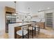 Bright kitchen island featuring quartz countertops, stylish pendant lights, and seating at 3937 Tamerlane Dr, Charlotte, NC 28205