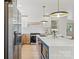Bright kitchen with stainless steel appliances, an island with seating, and sleek countertops at 3937 Tamerlane Dr, Charlotte, NC 28205