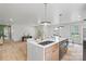 Modern kitchen featuring a center island with a sink and pendant lighting at 3937 Tamerlane Dr, Charlotte, NC 28205