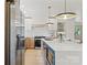 Modern kitchen with stainless steel appliances, quartz countertops, and a large island at 3937 Tamerlane Dr, Charlotte, NC 28205