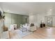 Cozy living room with modern decor, fireplace, and view to front door at 3937 Tamerlane Dr, Charlotte, NC 28205