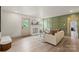 Stylish living room showcasing a decorative fireplace and a unique accent wall at 3937 Tamerlane Dr, Charlotte, NC 28205