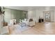 Bright living room with light hardwood floors, a decorative fireplace, and stylish furnishings at 3937 Tamerlane Dr, Charlotte, NC 28205