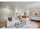 Open living room with modern decor and hardwood floors view of the kitchen at 3937 Tamerlane Dr, Charlotte, NC 28205