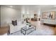 Spacious living area open to the kitchen featuring hardwood floors and modern decor at 3937 Tamerlane Dr, Charlotte, NC 28205