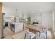 Open-concept living space featuring a kitchen, dining area and living room with hardwood floors at 3937 Tamerlane Dr, Charlotte, NC 28205