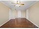 Bedroom featuring hardwood floors, neutral paint, ceiling fan, and closet at 4628 Dovefield Ln, Kannapolis, NC 28081