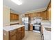 Traditional kitchen featuring stainless steel appliances, white countertops, and oak cabinets with an island at 4628 Dovefield Ln, Kannapolis, NC 28081