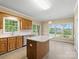 Bright eat-in kitchen featuring an island and views to the exterior at 4628 Dovefield Ln, Kannapolis, NC 28081