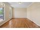 A bright, open room with hardwood floors and large windows. Perfect for entertaining and relaxation at 4628 Dovefield Ln, Kannapolis, NC 28081