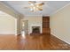 Cozy living room with hardwood floors, fireplace and built in shelving at 4628 Dovefield Ln, Kannapolis, NC 28081