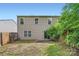 The backyard features a patio and fence and offers privacy with mature trees at 6335 Ziegler Ln, Charlotte, NC 28269