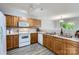 Well-lit kitchen with light wood cabinets, modern appliances, and a view into the adjacent dining area at 6335 Ziegler Ln, Charlotte, NC 28269