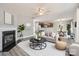 Inviting living room with a fireplace, modern furnishings, and an open layout connecting to the kitchen and dining areas at 6335 Ziegler Ln, Charlotte, NC 28269