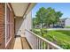 Charming porch offering a serene view of the landscaped front yard and quiet neighborhood street at 6335 Ziegler Ln, Charlotte, NC 28269