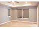 Bright bedroom with plush carpeting, recessed lights, and large windows for ample natural light at 745 Garrett Green Way, Fort Mill, SC 29715