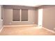 Spacious bedroom with neutral carpet, recessed lighting, and abundant natural light from two windows at 745 Garrett Green Way, Fort Mill, SC 29715