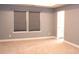 Generous bedroom with neutral walls and carpet with two windows providing plenty of sunlight at 745 Garrett Green Way, Fort Mill, SC 29715