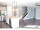 Modern kitchen featuring stainless steel appliances, marble backsplash, and a large kitchen island at 745 Garrett Green Way, Fort Mill, SC 29715