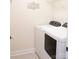 Efficient laundry room with a modern washer and dryer, complemented by clean, bright aesthetics at 745 Garrett Green Way, Fort Mill, SC 29715