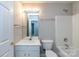 A bathroom with a single vanity, shower-tub combo and large mirror at 8040 Flanders St, Charlotte, NC 28277