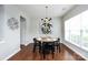 Modern dining room features a round table, black chairs, and a stylish chandelier at 8040 Flanders St, Charlotte, NC 28277