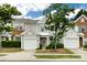 Charming townhome with a well-manicured lawn, attached garage, and inviting front entrance at 8040 Flanders St, Charlotte, NC 28277