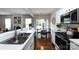 Bright kitchen featuring stainless steel appliances, white countertops, and an open view into the dining area at 8040 Flanders St, Charlotte, NC 28277