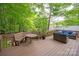 An expansive wooden deck with built-in bench seating offers an inviting outdoor space at 8227 Lansford Rd, Charlotte, NC 28277