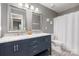 Bathroom featuring a double sink vanity and modern fixtures at 8227 Lansford Rd, Charlotte, NC 28277