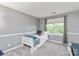 Bright bedroom with neutral walls and gray carpeting at 8227 Lansford Rd, Charlotte, NC 28277