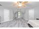 Bedroom features neutral paint, carpeted floor, ceiling fan, and window offering light at 8227 Lansford Rd, Charlotte, NC 28277