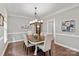 Dining room with a chandelier and hardwood floors, perfect for entertaining at 8227 Lansford Rd, Charlotte, NC 28277