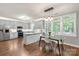 Open-concept kitchen and dining area filled with natural light from surrounding windows, perfect for Gathering gatherings at 8227 Lansford Rd, Charlotte, NC 28277