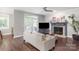 Comfortable living room with a fireplace and access to the outdoor deck at 8227 Lansford Rd, Charlotte, NC 28277