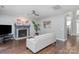 Bright living room with a decorative fireplace, stylish decor, and a comfortable sofa creating an inviting atmosphere at 8227 Lansford Rd, Charlotte, NC 28277