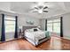 Inviting bedroom featuring tray ceiling and great natural light at 8227 Lansford Rd, Charlotte, NC 28277