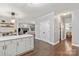 Open floor plan showing kitchen, dining area, and living room, creating a seamless and modern living space at 8227 Lansford Rd, Charlotte, NC 28277