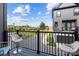 Private balcony with chairs offering views of the neighborhood and surrounding greenery at 8723 Nolley Ct, Charlotte, NC 28270