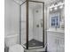 Bathroom with a glass shower, modern fixtures, and stylish tile at 8723 Nolley Ct, Charlotte, NC 28270