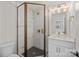Modern bathroom with glass enclosed shower, sleek fixtures, and stylish tile and lighting at 8723 Nolley Ct, Charlotte, NC 28270