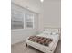 Bright bedroom with large window, neutral carpet, and stylish bed frame and decor at 8723 Nolley Ct, Charlotte, NC 28270