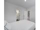Neutral bedroom featuring two doors to an ensuite bathroom and the hallway to the staircase at 8723 Nolley Ct, Charlotte, NC 28270