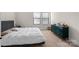 Comfortable bedroom showcasing a bed, stylish dresser, and natural light from the windows at 8723 Nolley Ct, Charlotte, NC 28270