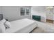 Inviting bedroom featuring a bed, large window, and a stylish dresser at 8723 Nolley Ct, Charlotte, NC 28270