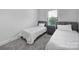 Shared bedroom featuring two twin beds, soft carpet and a window at 8723 Nolley Ct, Charlotte, NC 28270