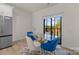 Dining area with modern table and chairs set, hardwood floors, and natural lighting at 8723 Nolley Ct, Charlotte, NC 28270